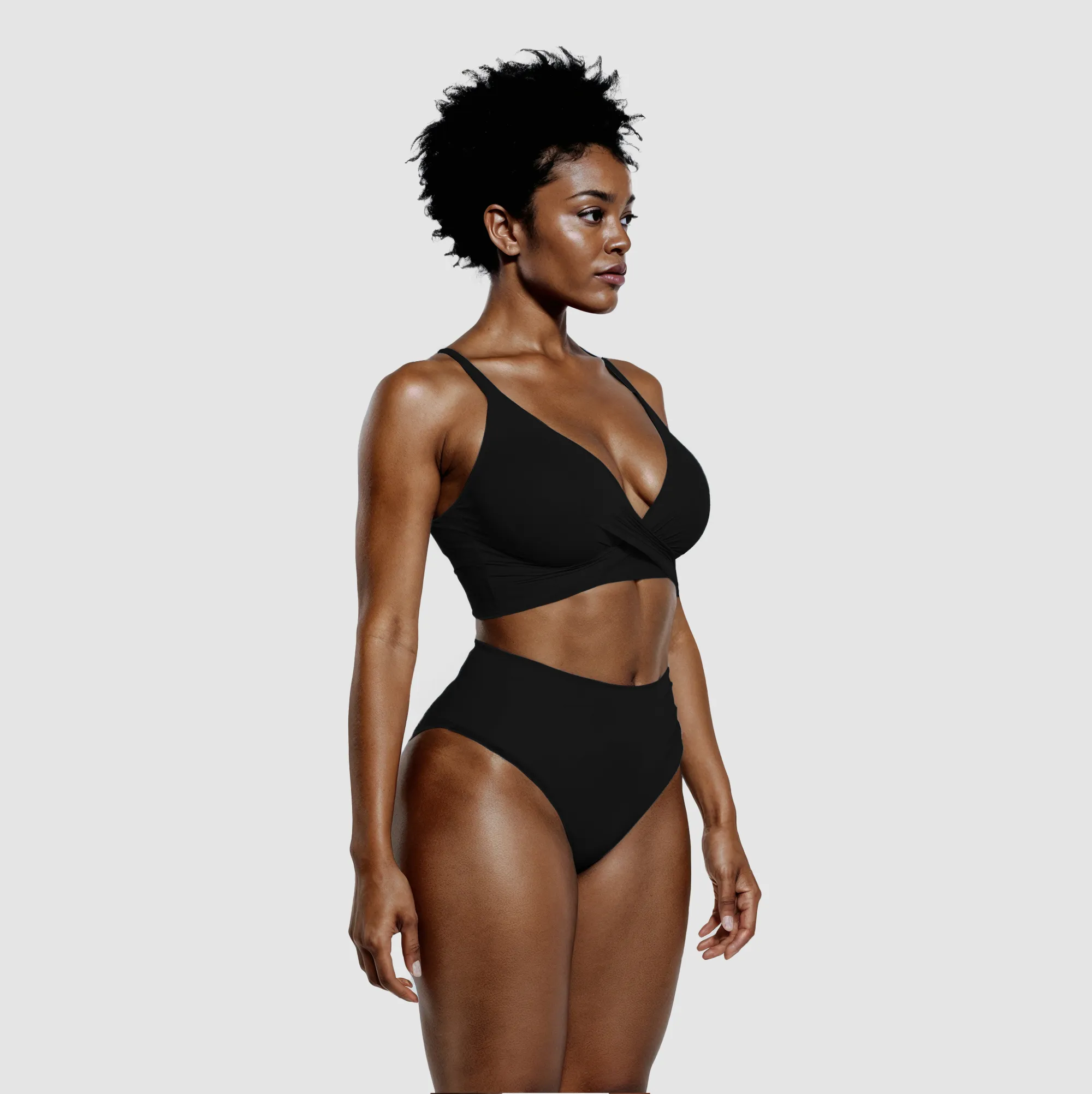Black high-waisted bikini with twist top at three-quarter angle