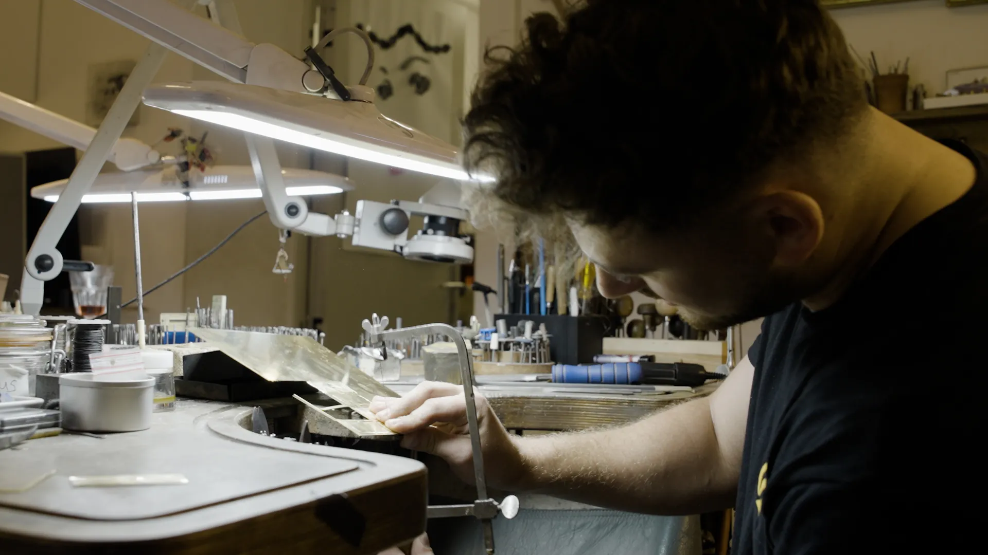 Tom sawing out the Iron Pike badge at the Cologne goldsmith's bench