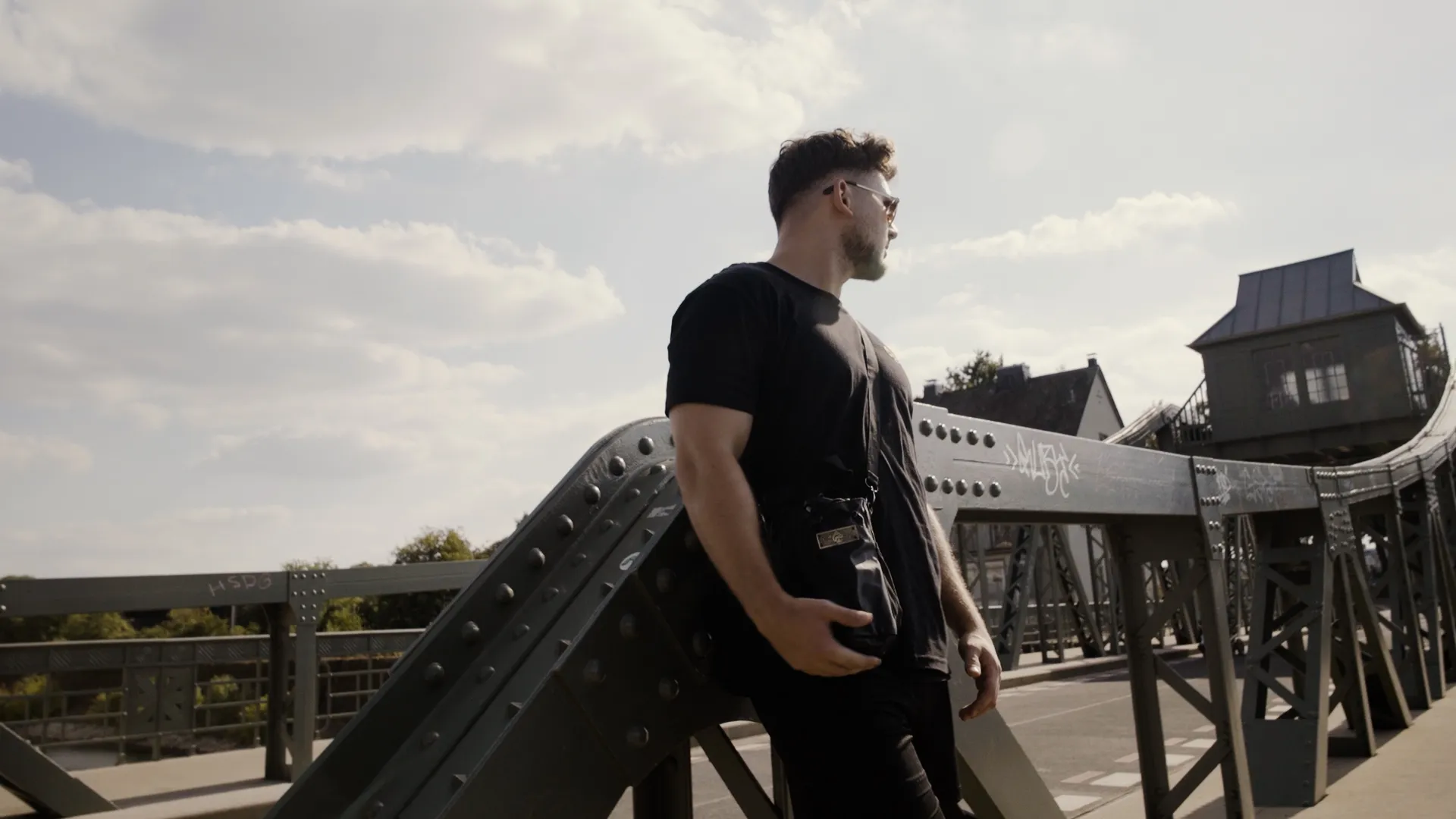 Tom carrying the Iron Pike bag on a recognisable Cologne bridge