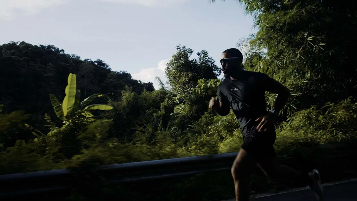 Runner in Mindset Studio gear jogging through the Phuket jungle