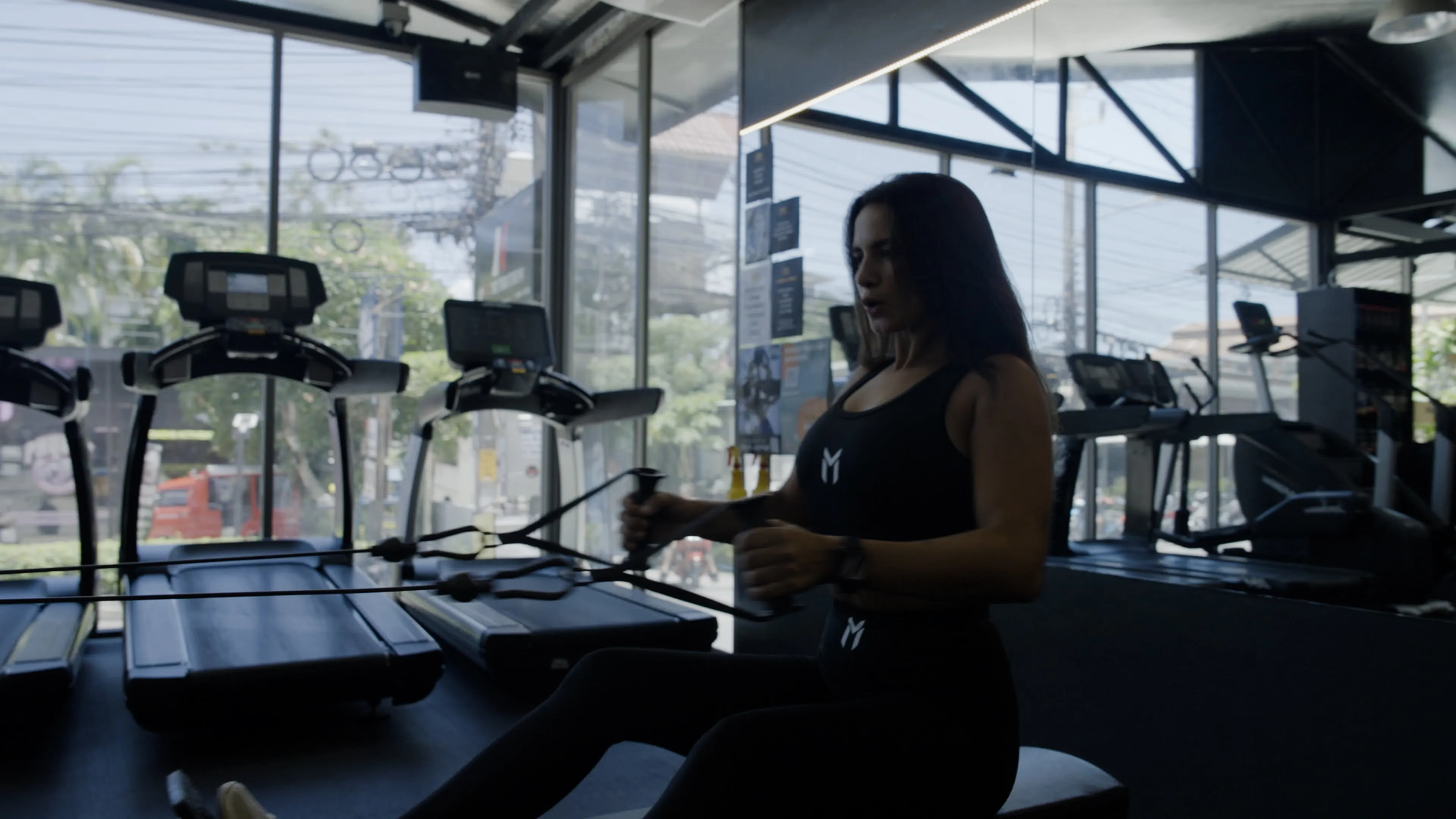Diana training at a gym on Phuket's fighting street, gritty look